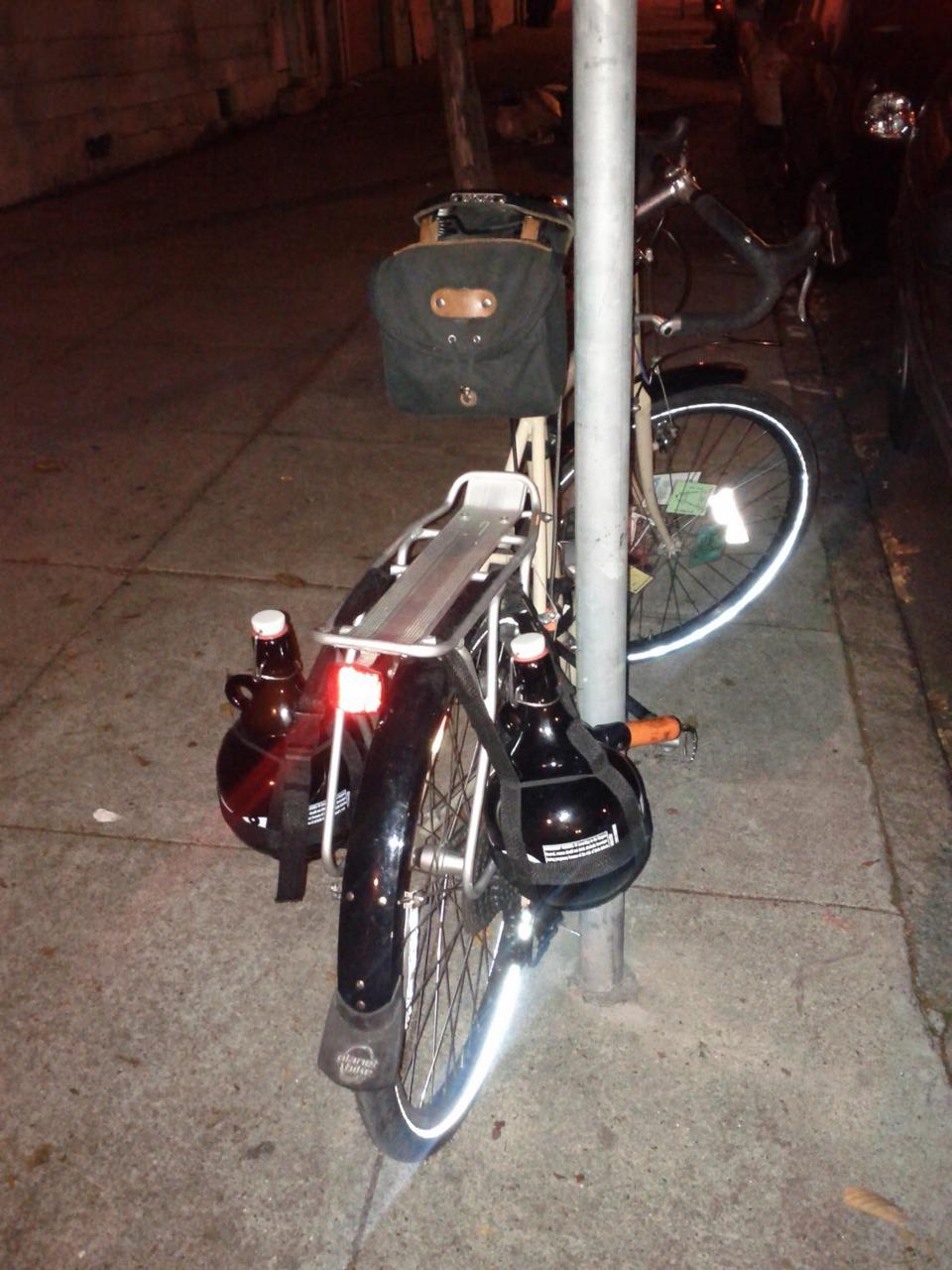Beer Growlers by bike.   Sure, it would be easy to just carry them in panniers or mesh bags... but for the heck of it, I made...