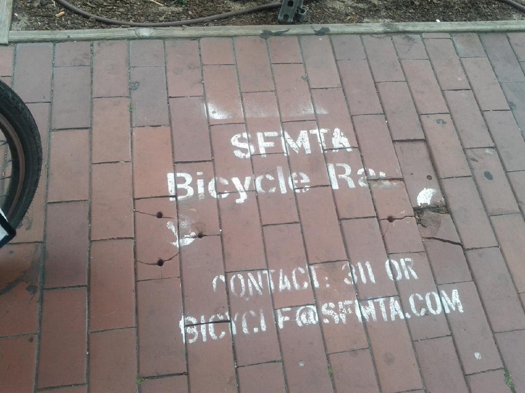 Bike rack torn out of sidewalk (hope no one lost their bike)