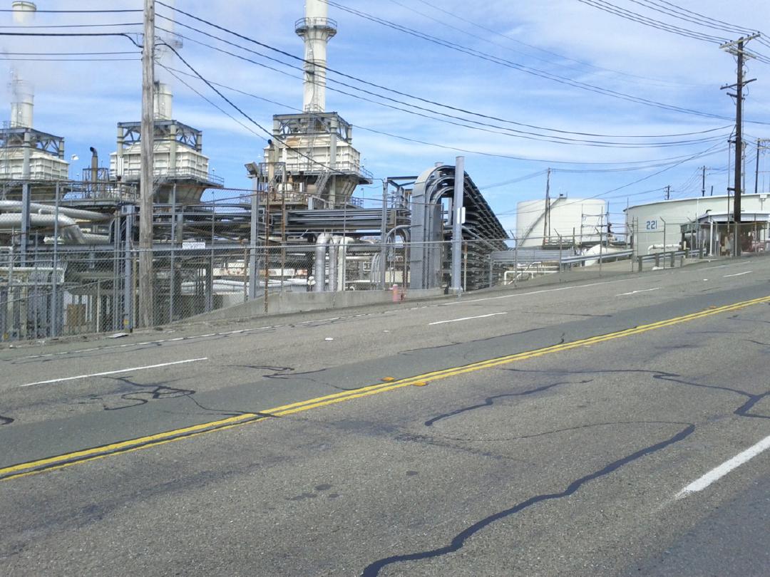 Biking by scenic oil refineries in Rodeo.
