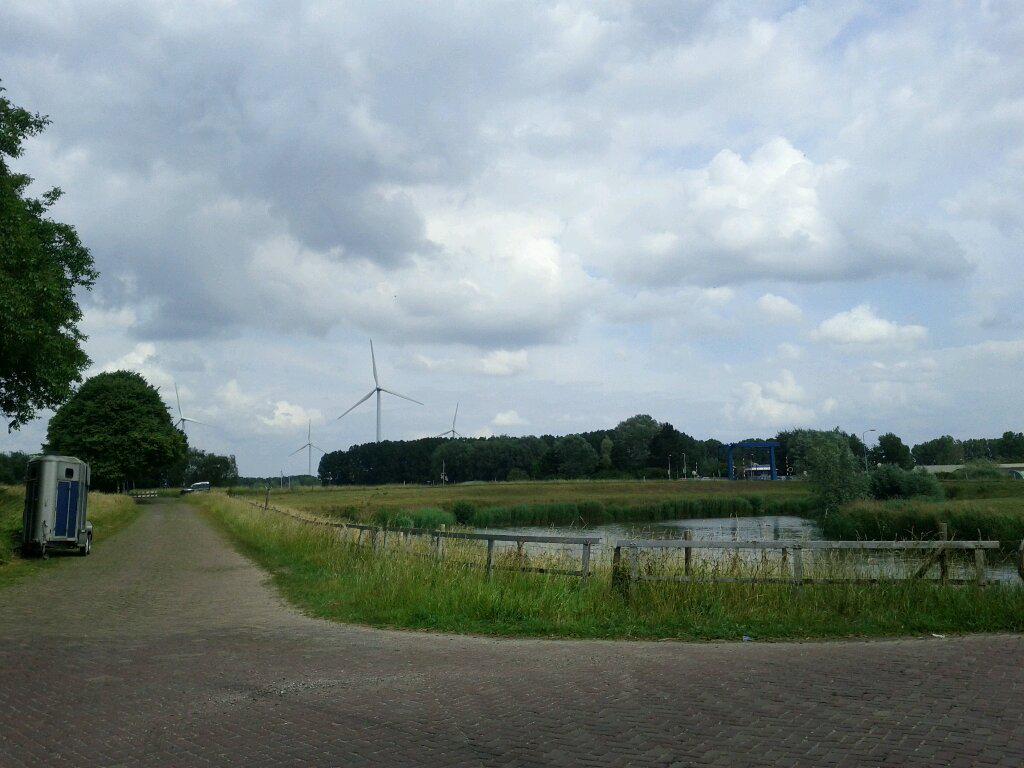 Biking past modern wind turbines