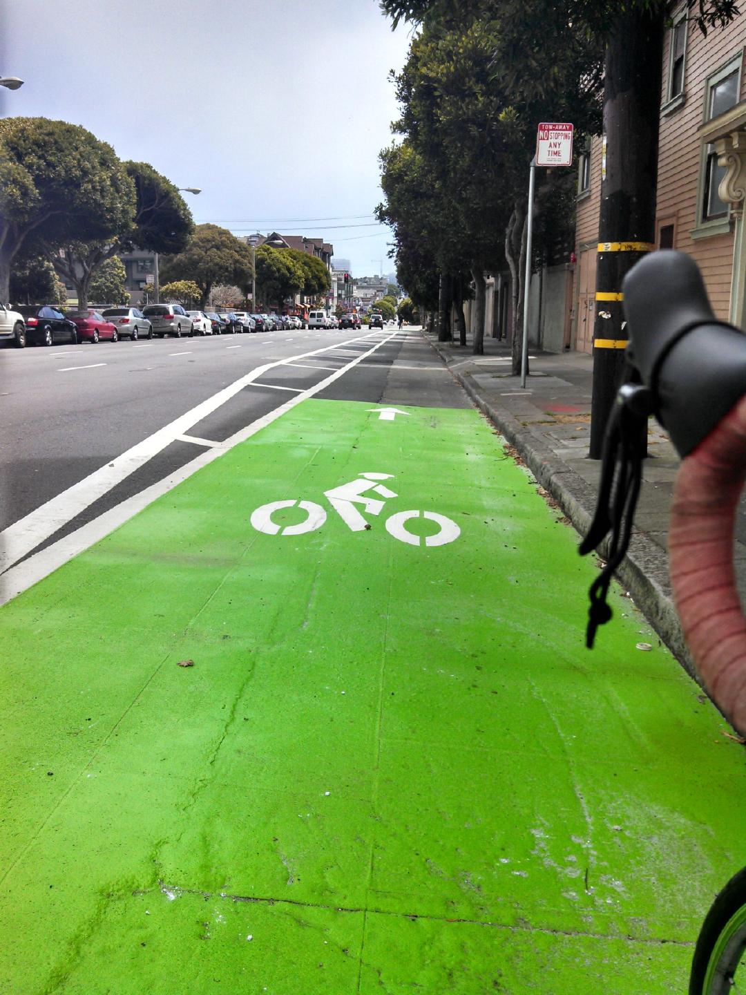 brand new, buffered, Oak St bike lane. this used to be parking.