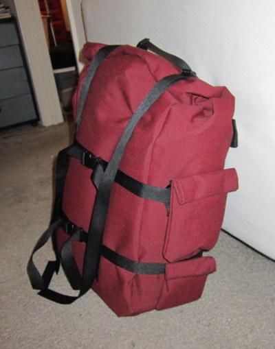 Fabricated: New & improved custom pannier made from marine upholstery, with compression straps, spring-loaded rack hooks, simple...