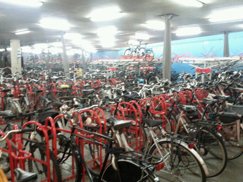 Free indoor (guarded) bike parking at train stations: