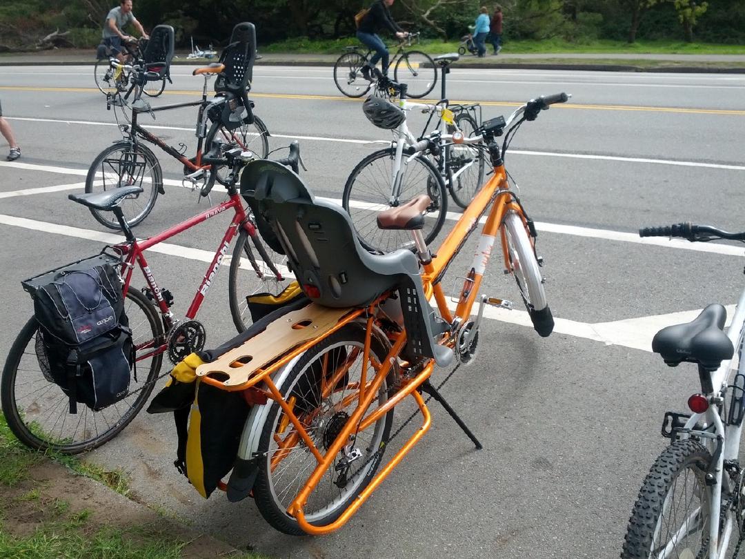 Friend's electric-assist Yuba longtail bike (w/ room for two kid seats). I took it for a few-minute test ride and it was fun.
