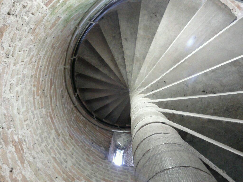 In Damme: climbing a few hundred tightly spiralling stone steps up a tower (in clicking, slick bike shoes-- fun...)