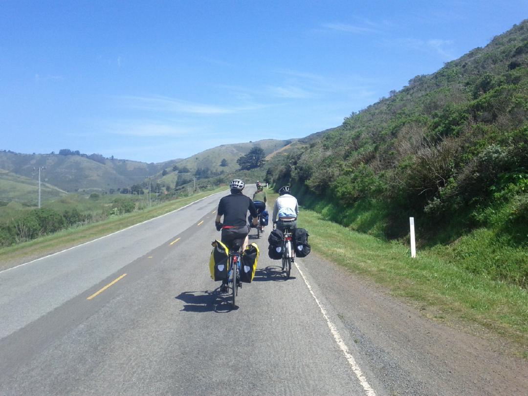 on the road with our luggage, on a beautiful day