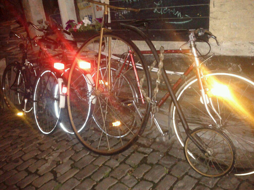 Pennyfarthing bicycle locked outside a strange tiny-garage-crammed-with-old-bikes bar in Gent yesterday.