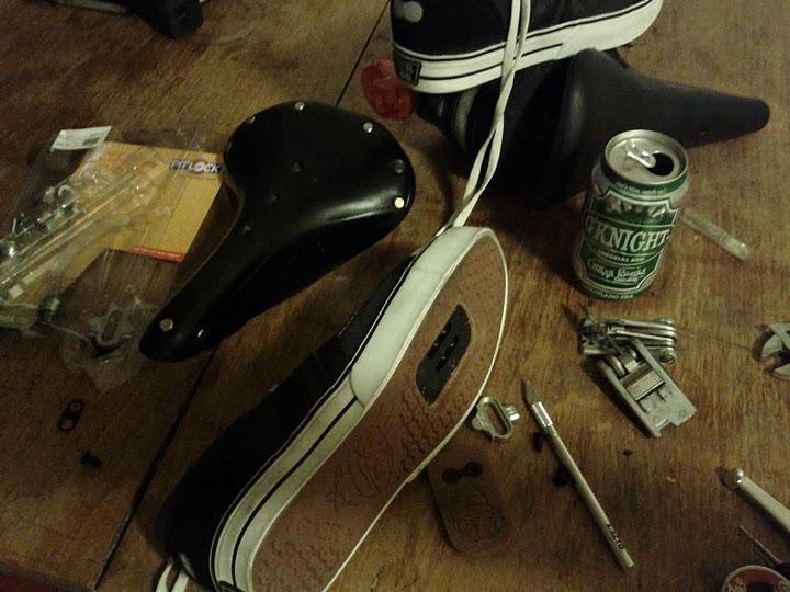 Work evening: cutting soles out of special sneakers for recessed pedal clips, installing new leather saddle and Pitlock security...